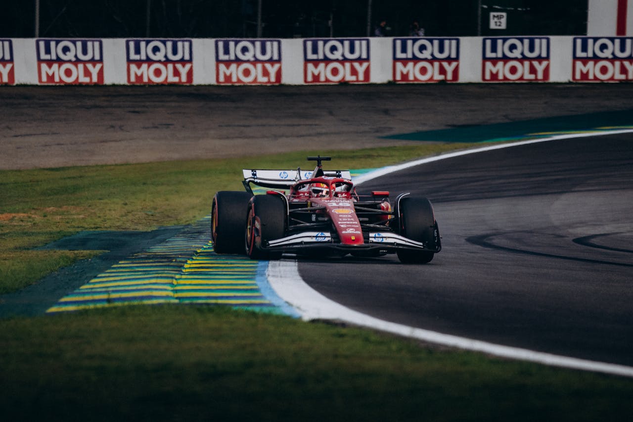 High-speed Formula 1 racing at Interlagos Circuit, São Paulo, Brazil.